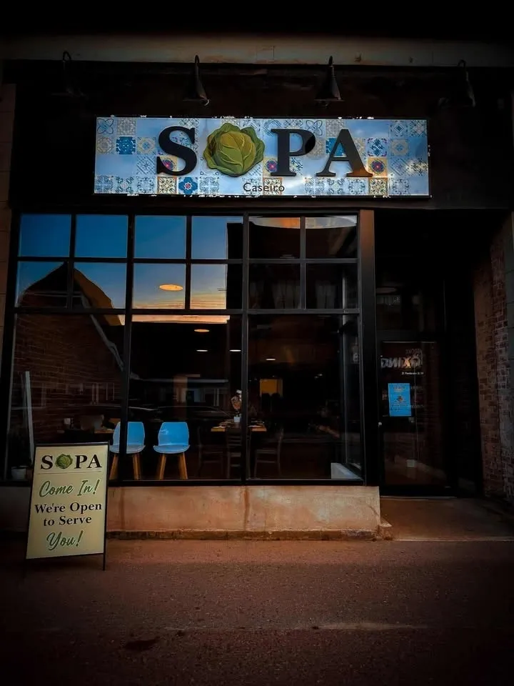 sopa storefront with sign